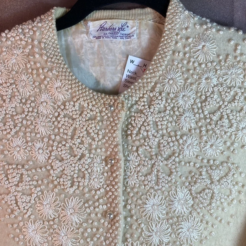 Vintage 50’s cream cardigan with pearls. Has holes.‎ 38” chest.  32” waist. B9